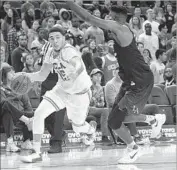  ?? Brian Rothmuller Associated Press ?? IN HIS ONLY game with UCLA, LiAngelo Ball drives against Cal State Los Angeles in an exhibition.