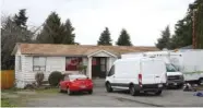  ?? ASSOCIATED PRESS PHOTOS ?? Above: Men attend Sunday services at the Gurudwara Singh Sabha, a Sikh temple in Renton, Wash. At Left: Vehicles sit Sunday at the home where a Sikh man was shot in the arm Friday in Kent, Wash. Authoritie­s said the gunman told him “go back to your own...