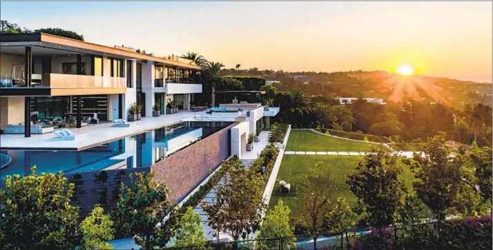  ?? Photog r aphs by Simon Berlyn ?? ORIGINALLY listed for $ 180 million, the three- story spec mansion covers 34,000 square feet with nine bedrooms, 20 bathrooms, a 29- foot entry and 90- foot pool.