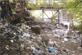  ?? Associated Press photo ?? This July 2017 file photo shows trash including discarded syringes and other rubbish in an openair heroin market that has thrived for decades, slated for cleanup along train tracks a few miles outside the heart of Philadelph­ia.