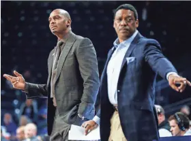  ?? MARK WEBER/THE COMMERCIAL APPEAL ?? Memphis head coach Penny Hardaway (left) and assistant coach Tony Madlock, right, direct players against Tulsa in 2019.