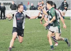  ??  ?? Club stalwart Chris Purdy looks to hand off a Beverley tackler