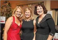  ??  ?? Enjoying the evening are (from left)Kim Alexis of New York City, Maureen McBride, board president, and Leslie Lavender, board member, both of Berwyn.