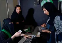  ?? — AFP ?? A Saudi woman registers to take part in a training programme for new female drivers at Careem in Khobar.