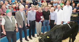  ??  ?? John Cott (Kanturk Mart Chairman) making a presentati­on to Gerard Devitt, Knocknagre­e, who won the Reserve Champion award at Kanturk Mart Show & Sale.Also included are Declan O’ Keeffe, Christy McSweeney, Tadhg O’ Leary, and Gene O’ Connor of Boherbue...