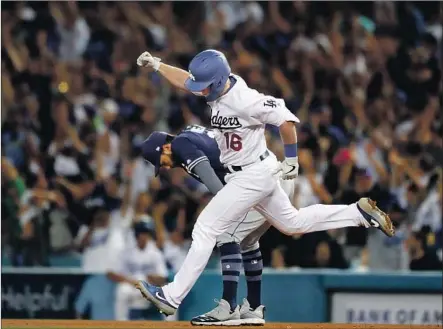  ?? Luis Sinco Los Angeles Times ?? IT’S ANOTHER BIG home run trot for Will Smith, after the rookie’s grand slam in the sixth inning gave the Dodgers a 5-2 lead.