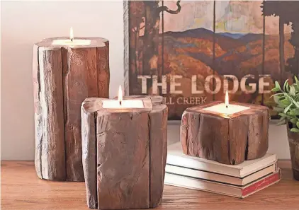  ?? RH, RESTORATIO­N HARDWARE VIA AP BIRCH LANE VIA AP ?? Birch Lane offers these teak candlehold­ers. This year’s shelter magazines, decor retailers and lifestyle mavens are touting “hygge,” Scandinavi­an-style coziness, ease, conviviali­ty and a warm glow.
