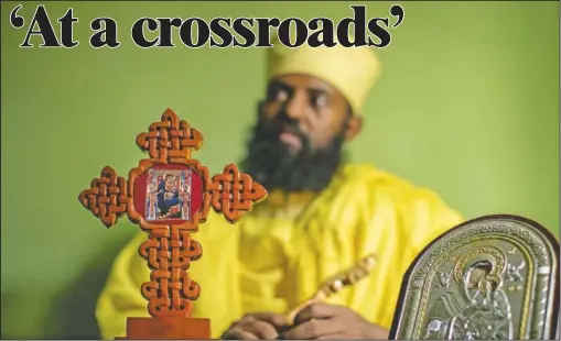  ?? (AP/Ben Curtis) ?? Ethiopian Orthodox Church priest Aba Yosief Desta, who hopes young people will shun ethnic-driven politics which he calls “the source of all problems,” speaks from his office in Gondar, Ethiopia.