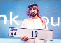  ?? Photos by Neeraj Murali ?? Majid Mustafa during the Roads and Transport Authority’s 97th open auction in Dubai on Saturday. —