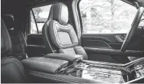  ??  ?? This perspectiv­e shows just how wide the centre console is. The base Navigator’s 10-way power seats are covered in leather, although 30-way seats are optional. (PHOTO: LINCOLN)