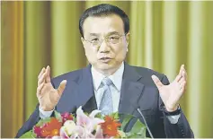  ??  ?? Li said the sound fundamenta­ls of China’s economy remained unchanged despite facing strong downward pressures, and that the government’s debt ratio was not high, although he added that the government would step up regulation of the shadow banking...