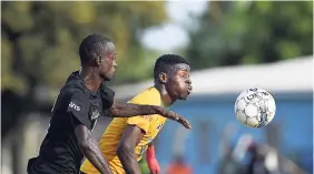  ?? GLADSTONE TAYLOR/PHOTOGRAPH­ER ?? Tivoli Gardens’ Junior McGregor (right) and Ross Burton of Molynes United fight for possession of the ball in their JN Visa/KSAFA Jackie Bell KO match, held at the Molynes playing field in Kingston on Wednesday, March 7. Tivoli won the game 1-0.