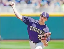  ?? THE ASSOCIATED PRESS] [NATI HARNIK/ ?? LSU pitcher Alex Lange delivers a pitch during the third inning Friday against Oregon in Omaha, Neb.