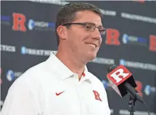  ?? MARK R. SULLIVAN, AP ?? “When you come here, there’s a dark cloud. ... The challenge is to try and remove that,” new Rutgers coach Chris Ash says.