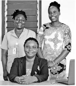  ??  ?? Sherrie Ellis-Wallace (seated) with Arleen Robinson-Wildman (left) and Dr Tamara Henry.