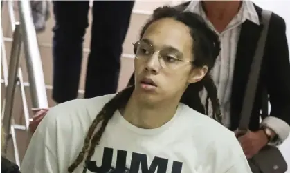  ?? ?? WNBA star Brittney Griner is escorted to a courtroom for a hearing, in Khimki City Court outside Moscow on Friday. Photograph: Maxim Shipenkov/EPA