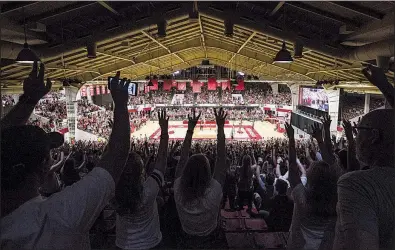  ?? NWA Democrat-Gazette/BEN GOFF ?? Arkansas fans call the Hogs before the men’s basketball team’s Red-White game Saturday at Barnhill Arena in Fayettevil­le. The Razorbacks held their intrasquad scrimmage at Barnhill, which was the program’s home court in 1958-93. See more photos at arkansason­line.com/106redwhit­e.