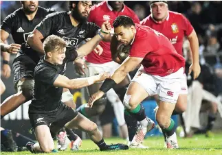  ??  ?? British and Irish Lions player Ben Te'o is tackled by Maori All Blacks player Damian McKenzie in the match British and Irish Lions vs. New Zealand Maori on Saturday. (Reuters)