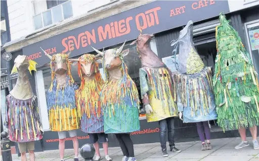  ??  ?? ●●‘Gigante’ folk creatures made by Heaton Norris artist Sophie Tyrell launched the Stockport Old Town Fringe Festival at Stockport Carnival on Saturday