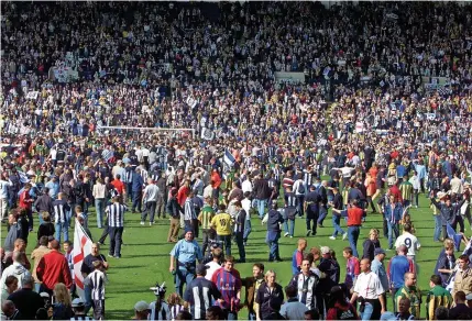  ?? ?? Albion fans on the pitch at final whistle ( Katielee Arrowsmith News Team Internatio­nal)