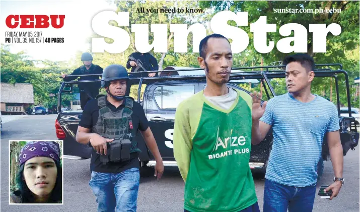  ?? SUNSTAR FOTO / ALAN TANGCAWAN ?? NO RESISTANCE. Saad Samad Kiram (in green shirt) is escorted by law enforcers after his non-violent arrest in Tubigon, Bohol. Kiram had begged a farmer in Tubigon, Bohol for food and clothes and was later found out to be part of the Abu Sayyaf Group...