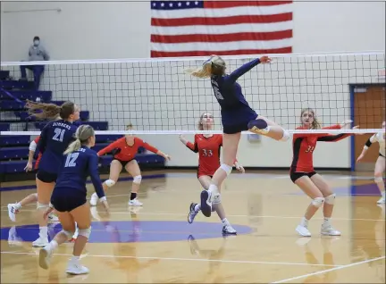  ?? TIM PHILLIS — FOR THE NEWS-HERALD ?? Kenston’s Julia Sell (15) goes up for a kill attempt for the Bombers.