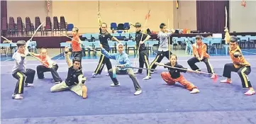  ??  ?? The Sarawak wushu team are all fired up for the challenge in Sukma VIII.