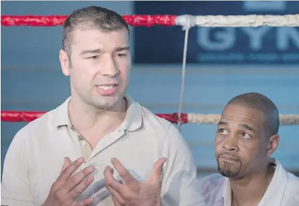  ?? GRAHAM HUGHES/THE CANADIAN PRESS ?? Boxer Lucian Bute speaks to reporters in Montreal on Friday, a day after testing positive for a banned substance. His trainer, Howard Grant, said the failed test is “mind boggling.”