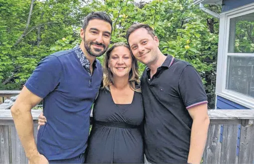  ?? CONTRIBUTE­D ?? Fathers-to-be Carl Mastrovito, left, and Alexandre Béland of Montreal pose with their surrogate, Lesley Rumsey of St. John’s, who will give birth to their first child in November. The dads say they are proud their baby will be born in Newfoundla­nd and are looking forward to sharing the story with her.