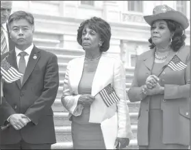  ?? AP Photo/J. Scott Applewhite ?? Standing together: Rep. Ted Lieu, D-Calif., Rep. Maxine Waters, D-Calif., and Rep. Frederica Wilson, D-Fla., join other House Democrats gather at the Capitol to call for passage of the Keep Families Together Act, legislatio­n to end the Trump...