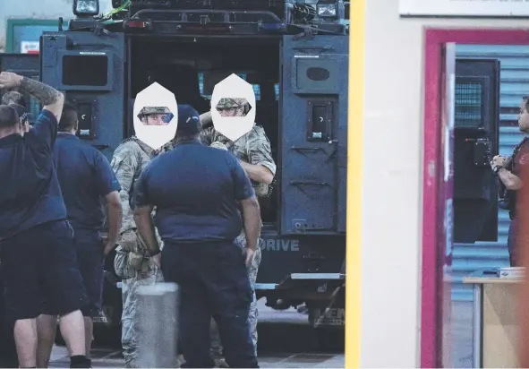  ??  ?? Police are seen at the front of Don Dale Detention centre last night Picture: KERI MEGELUS