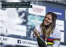  ??  ?? Rachel Atherton celebrates her incredible fifth World Champs win