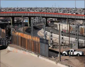  ?? AP/ERIC GAY ?? A new barrier rises last month along the U.S.-Mexico border near downtown El Paso, Texas.