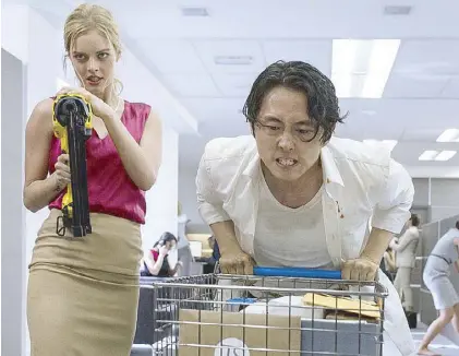  ??  ?? Steven Yeun and Samara Weaving in a scene from the thriller, distribute­d locally by Star Cinema, that is set to open on Nov. 8 in cinemas