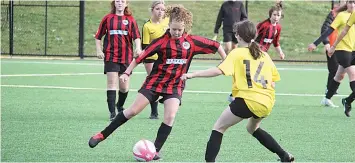  ?? ?? Warragul United under 13 girls player Summer Spencer looks to use her deft foot skills to avoid her opposing defender.