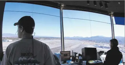  ?? Don Bartletti Los Angeles Times ?? AIR TRAFFIC controller­s at Palm Springs Internatio­nal. The FAA’s NextGen project is replacing radar-based f light monitoring.