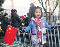  ?? PHOTO: LUISA GIRAO ?? Flying the flag . . . Nancy Wu (4) waves the Chinese flag during a celebratio­n of the 71st anniversar­y of the founding of the People’s Republic of China in Invercargi­ll yesterday.