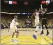  ?? EZRA SHAW — POOL PHOTO VIA AP ?? Warriors forward Kevin Durant, center, defends a shot by Kevin Love during Game 2 of the NBA Finals.