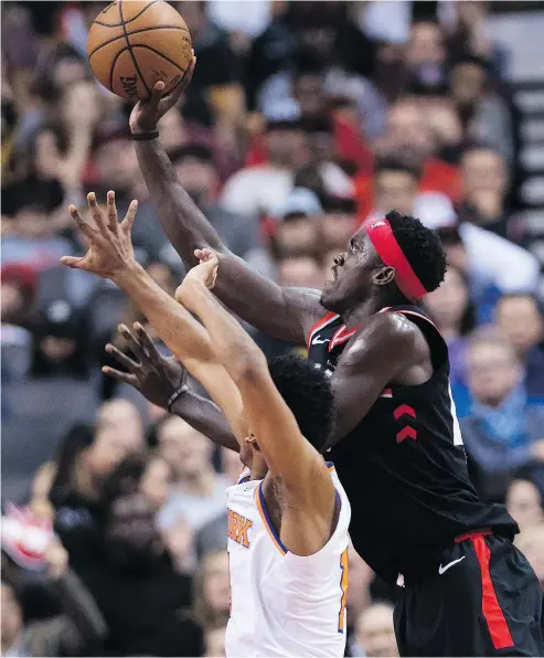  ?? — THE CANADIAN PRESS ?? Raptors forward Pascal Siakam drives to the net past Knicks guard Allonzo Trier during their game in Toronto on Saturday. Siakim scored a career-high 23 points in the win.