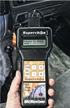  ??  ?? Before removing the PCM from the truck for preparatio­n and install of the new Hydra chip, we first wanted to be sure it was returned to a factory file. This step isn’t mandatory, as once installed onto the PCM, the new Hydra chip will over ride anything programmed in to the PCM, but it by returning the previous owners old school Superchips Microtuner back to stock, we now have a piece of vintage tuning hardware we could loan out or sell to someone feeling nostalgic to tune their 7.3L with.