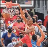  ?? USA Today Sports - Dale Zanine ?? Hawks center Onyeka Okongwu dunks the ball during the Eastern Conference finals against the Bucks.