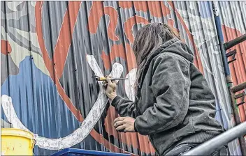  ?? ERNEST CADEGAN ?? Artist, printmaker, and NSCAD professor Ericka Walker has created a mural in the Uncommon Common Art project for 2018. She explores the subject of agricultur­e, farm implements, and the advancemen­t of science and how they impacted life and environmen­t....