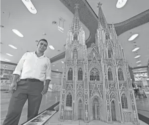  ?? ?? Alkhudr started to carve the local Cologne Cathedral in 2019 in his small basement, without any plans or drawings, using only cell phone photos of the cathedral as a template.