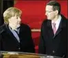  ??  ?? Premier Morawiecki und Kanzlerin Merkel. Foto: rtr