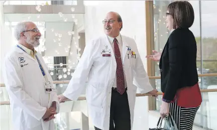  ?? TONY CALDWELL ?? Dr. Harold Atkins, left, with Dr. Mark Freedman and Jennifer Molson, will be honoured Tuesday for his ‘exceptiona­l’ stem cell research.