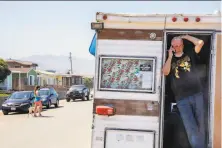  ?? Jessica Christian / The Chronicle 2020 ?? Jeffrey Allen Russell stands in the doorway of his RV, which was parked on a residentia­l street in Pacifica on May 27.