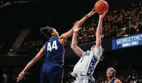  ?? Terrance Williams/Associated Press ?? Georgetown guard Kelsey Ransom (1) has her shot blocked by UConn forward Aubrey Griffin (44) during the second half of an NCAA college basketball game on Feb. 11 in Washington.