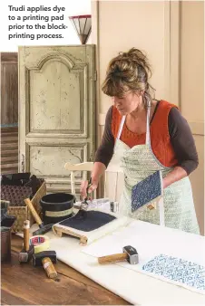  ??  ?? Trudi applies dye to a printing pad prior to the blockprint­ing process.