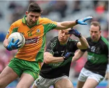  ?? ?? OFF TO A FLYER: Corofin’s Martin Farragher breaks away from Alan Cronin of Nemo Rangers at Croke Park