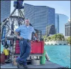  ?? Caroline Brehman Las Vegas Review-Journal ?? Lead engineer Loni Singer uses a barge to maintain the fountains.